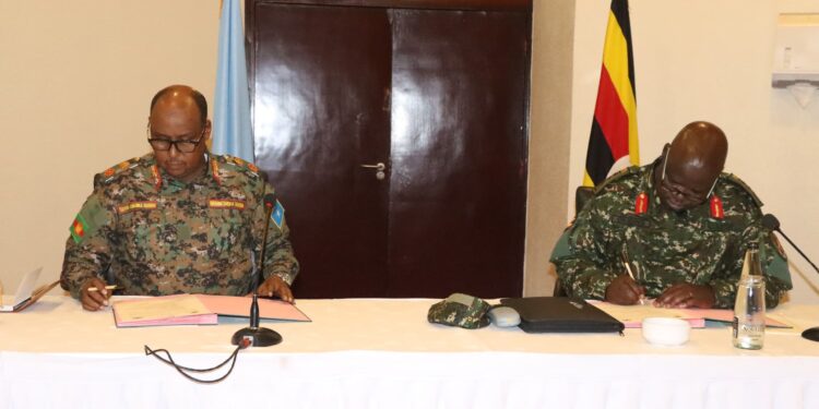 Uganda And Somalia Sign Implementation Agreement To Forge Stronger Security Ties